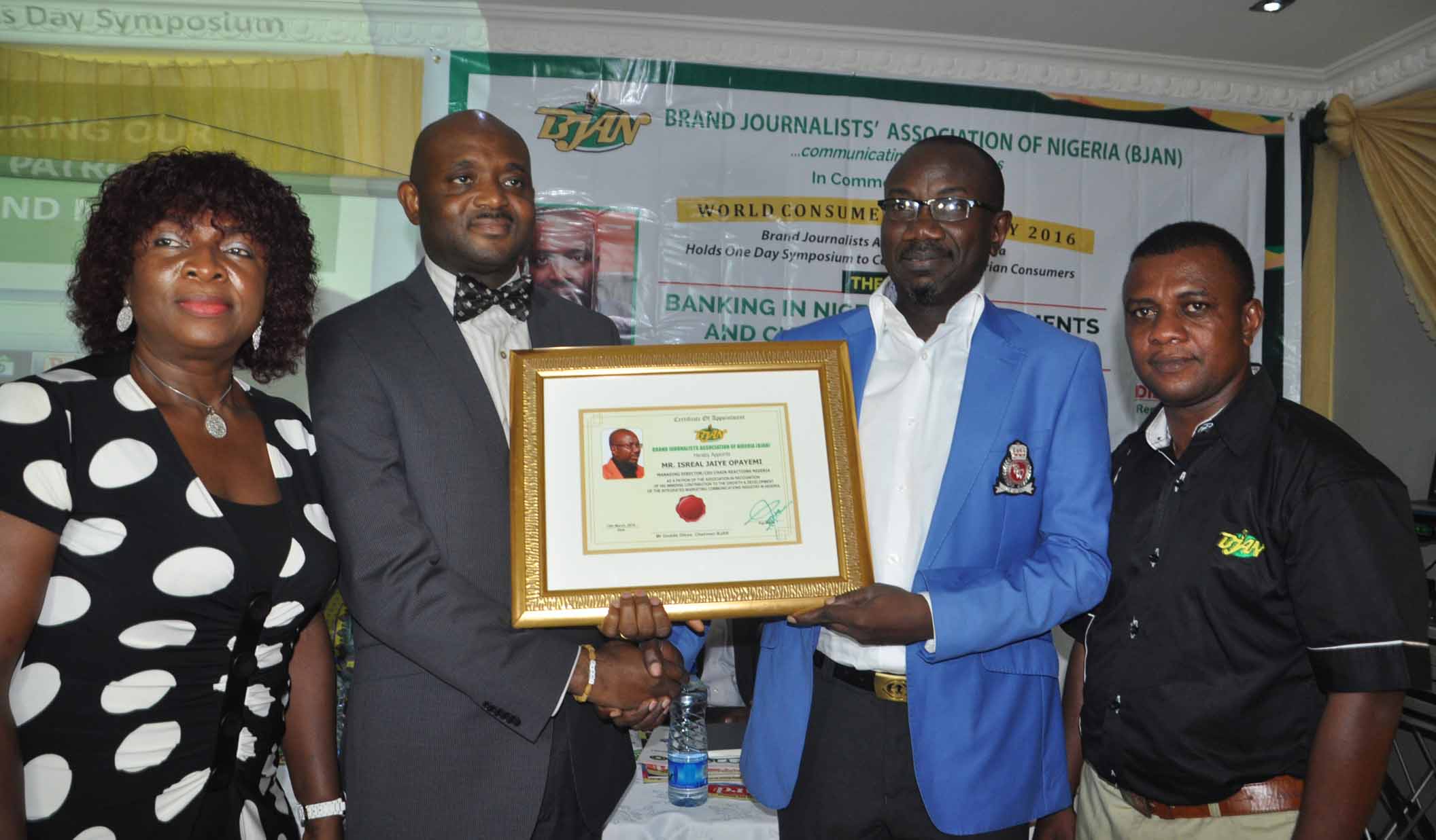 L-R: Mrs Neta Nwosu, former Chairman of BJAN, Mr. Celey Okogun, MD/CEO, Novel Potter presenting award to Mr. Isreal Jaiye Opayemi, MD/Chief Strategist, Chain Reactions Nigeria and Mr. Goddie Ofose, Chairman BJAN looks on at the 4th Brand Journalist Association of Nigeria (BJAN) Consumer Rights Day Symposium 2016, with the theme: Banking in Nigeria Developments and Customers Challenges held at White House Hotel GRA-Ikeja Lagos. 