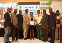 Ikeja Electric Bags Corporate Pacesetter, HSE Campaign Of The Year Awards Third from left, Mr Steve Doriigi, Operation Manager, Ikeja City Mall and third from right, Hon. Kehinde Bamigbetan, Commissioner for Information and Strategy, Lagos State and Ikeja Electric Safety Officers displaying their awards during 2018 Nigeria Safety Award for Excellence (9jaSAFE Award) in Lagos-marketingspace.com.ng